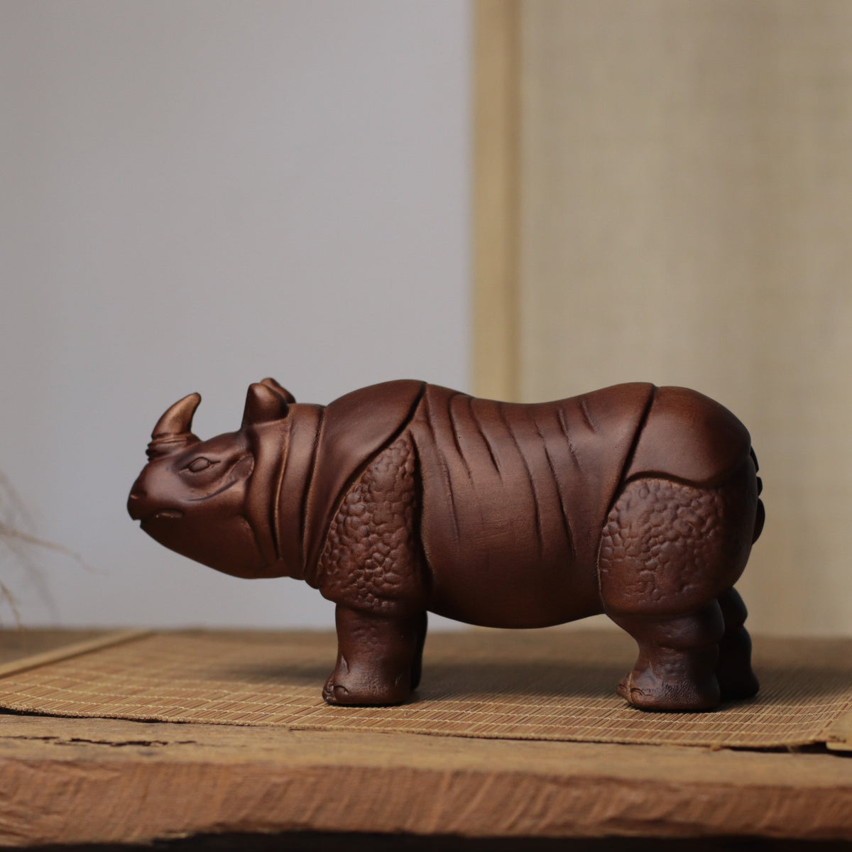 Hand-Carved Rhino Figurine in Khaya Wood