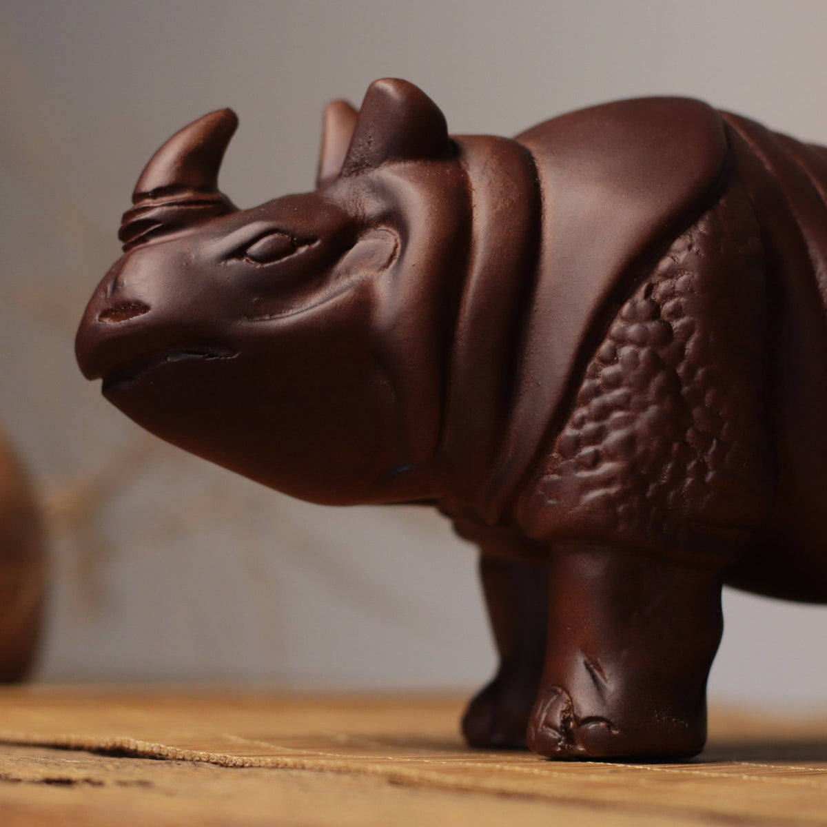 Hand-Carved Rhino Figurine in Khaya Wood