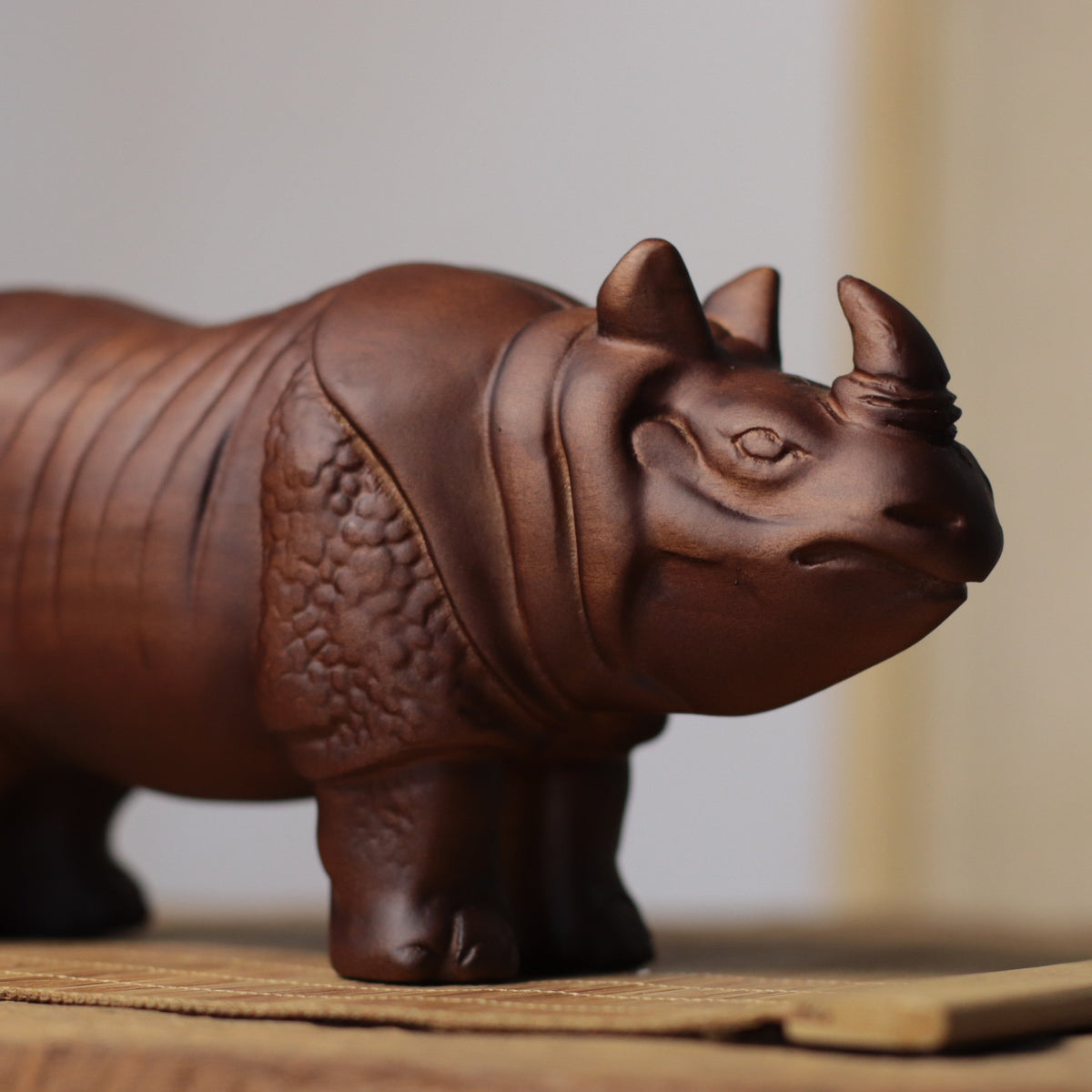 Hand-Carved Rhino Figurine in Khaya Wood