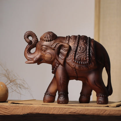 Raised-Trunk Elephant Sculpture in Khaya Wood