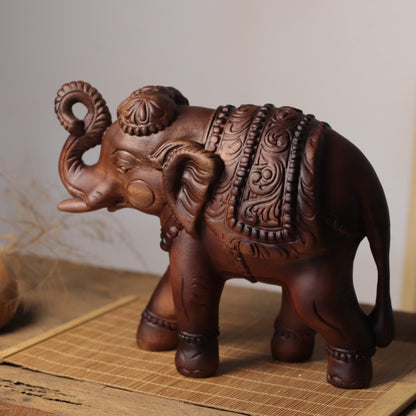 Raised-Trunk Elephant Sculpture in Khaya Wood
