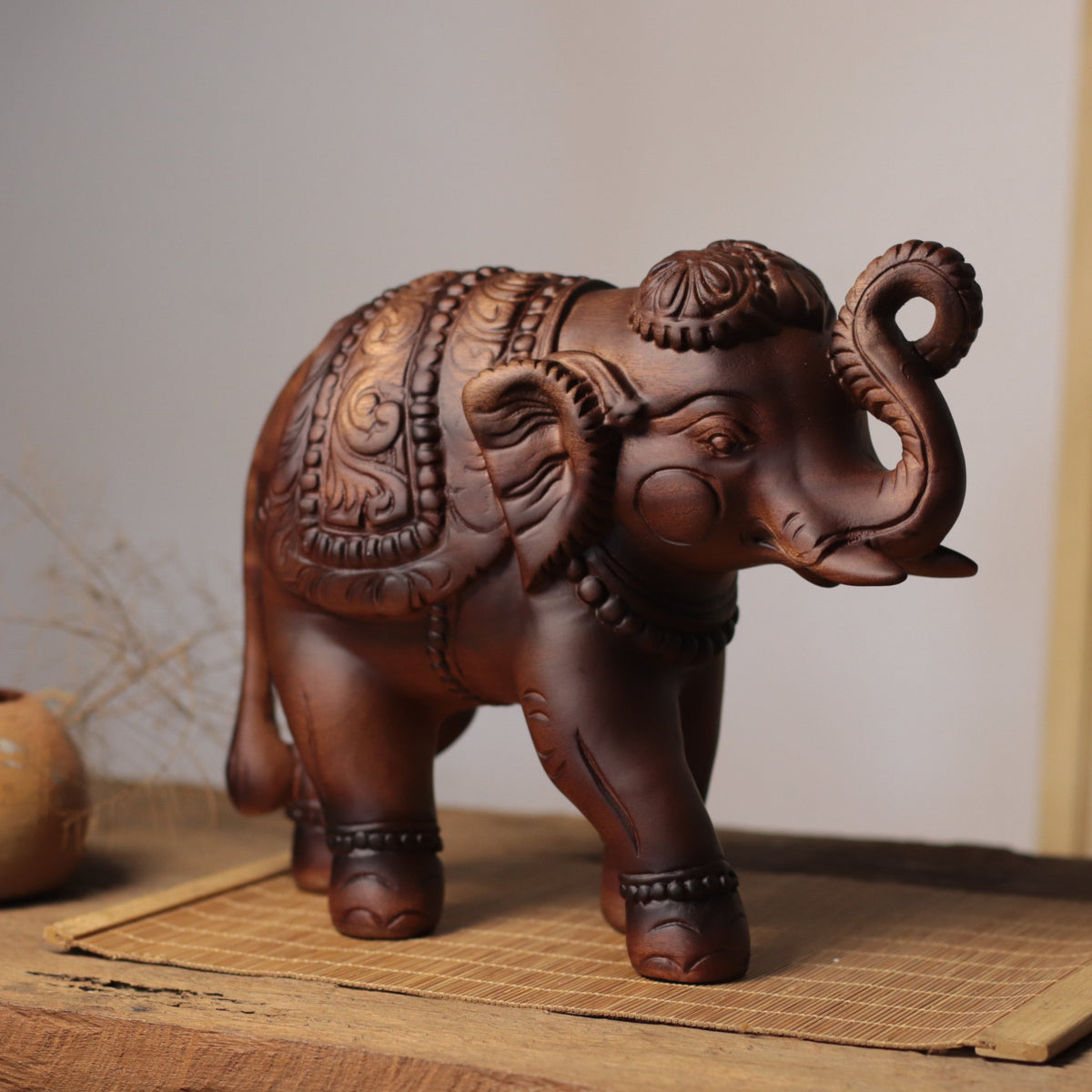Raised-Trunk Elephant Sculpture in Khaya Wood