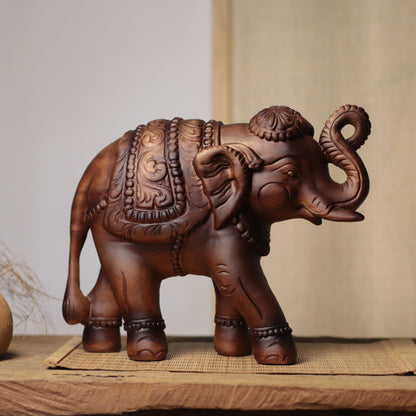 Raised-Trunk Elephant Sculpture in Khaya Wood