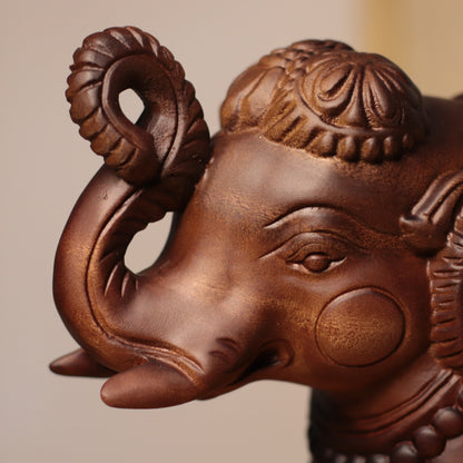 Raised-Trunk Elephant Sculpture in Khaya Wood