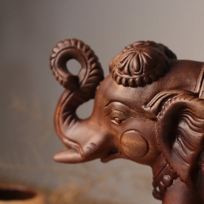 Raised-Trunk Elephant Sculpture in Khaya Wood