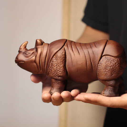 Hand-Carved Rhino Figurine in Khaya Wood